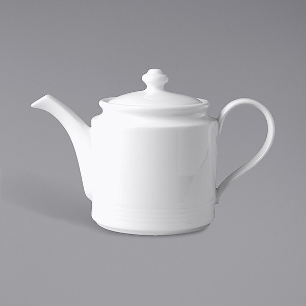 A close up of a RAK Porcelain ivory teapot with a lid and white handle.