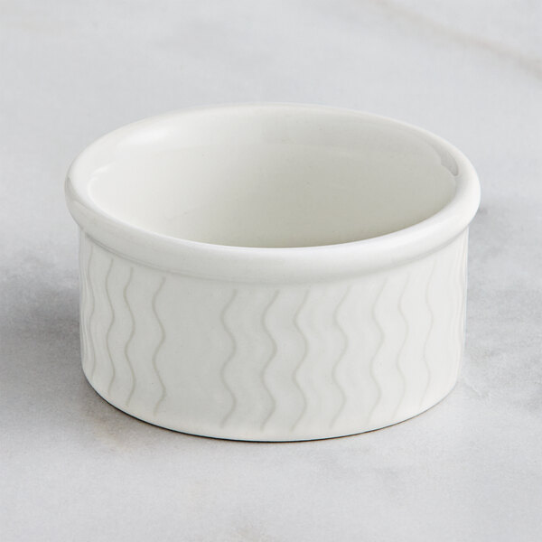 A RAK Porcelain ivory porcelain ramekin with wavy lines.