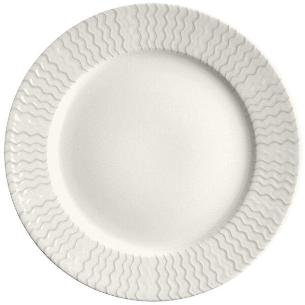 A RAK Porcelain ivory porcelain plate with wavy lines on the rim.