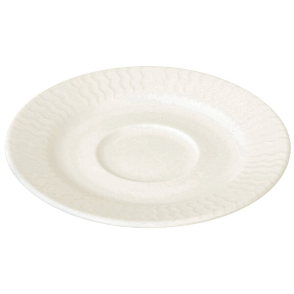 A white RAK Porcelain saucer with a circular edge and pattern on it.