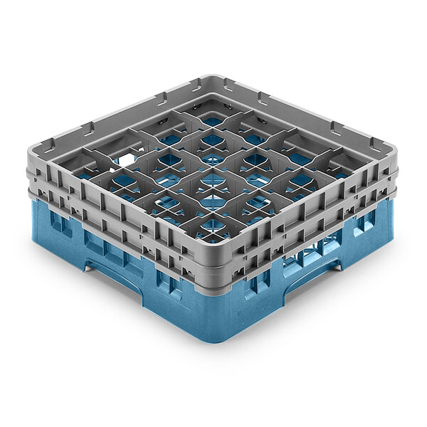 A teal and grey plastic Cambro glass rack with 16 compartments and 5 extenders.