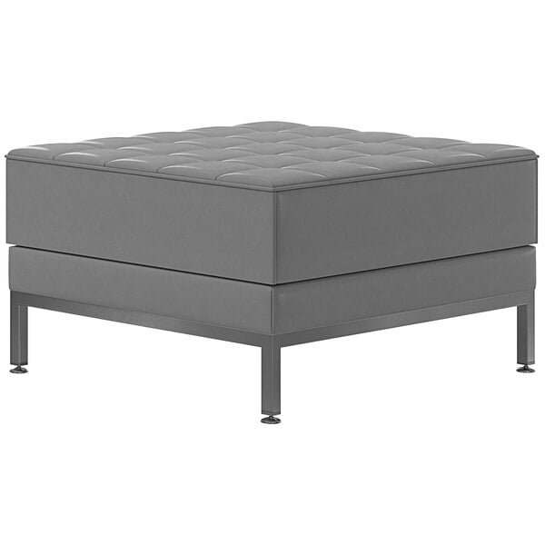 A grey square Flash Furniture ottoman with metal legs.