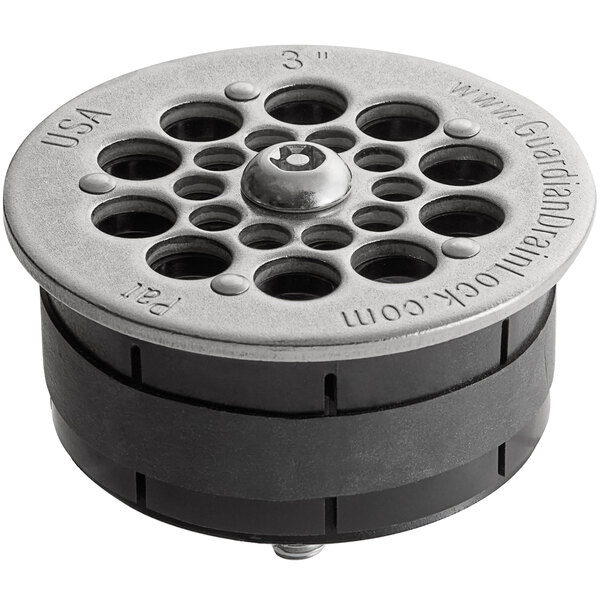 A round metal Guardian Drain Lock with holes in it.