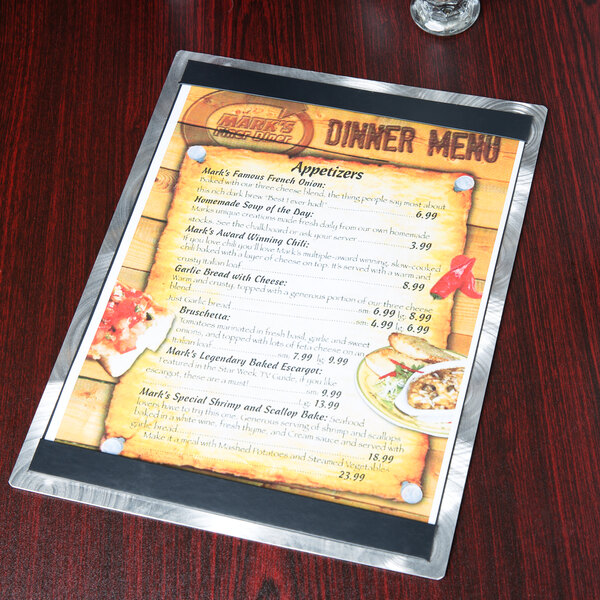 An Alumitique aluminum menu board on a table in a Mexican restaurant.