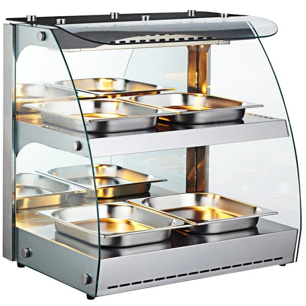 An Omcan heated display case with trays on it.