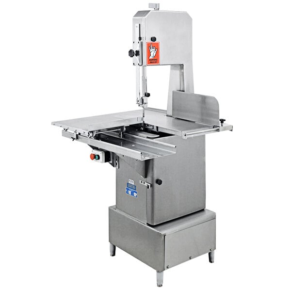 A stainless steel Omcan electric vertical band saw with a machine on it.