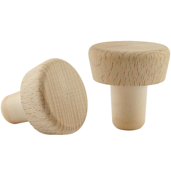 A pair of Franmara plastic and beechwood bottle stoppers. One stopper has a beechwood mushroom-shaped top.