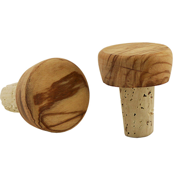 A pair of cork bottle stoppers with olivewood tops.