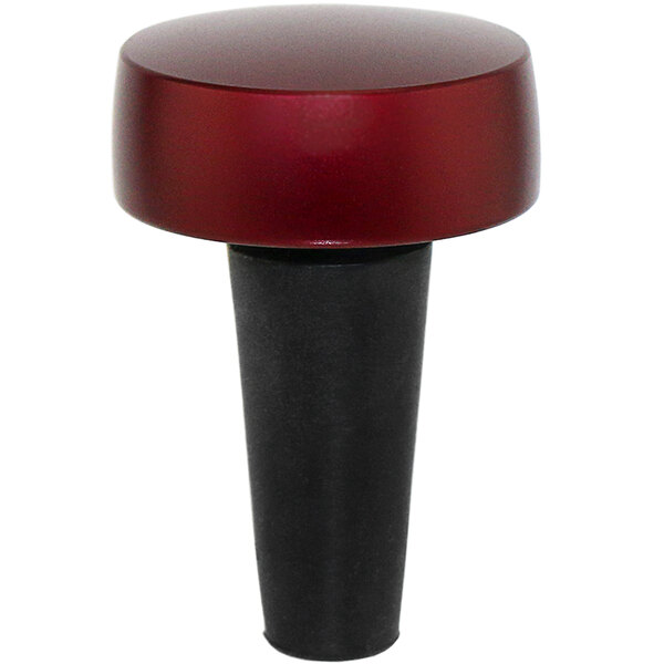 A red bottle stopper with a black base.