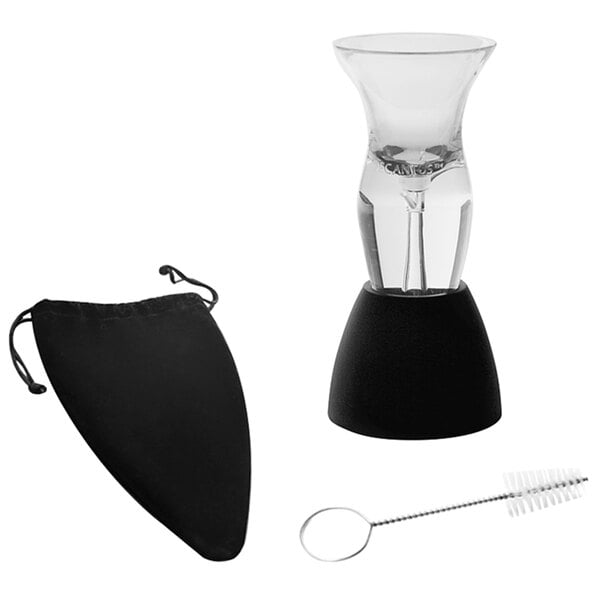 A Decantus wine aerator set with a glass of wine and a brush inside a black bag with drawstring.