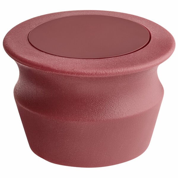 A red plastic container with a round top.
