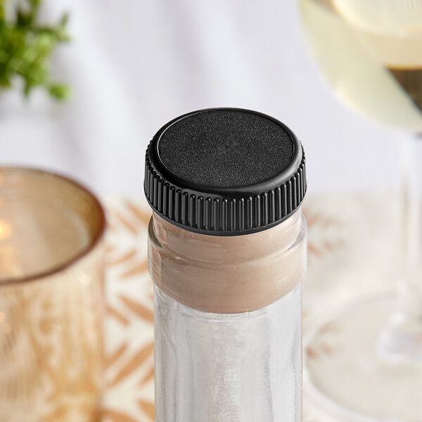 A wine bottle with a Franmara T-Top bottle stopper on a table.