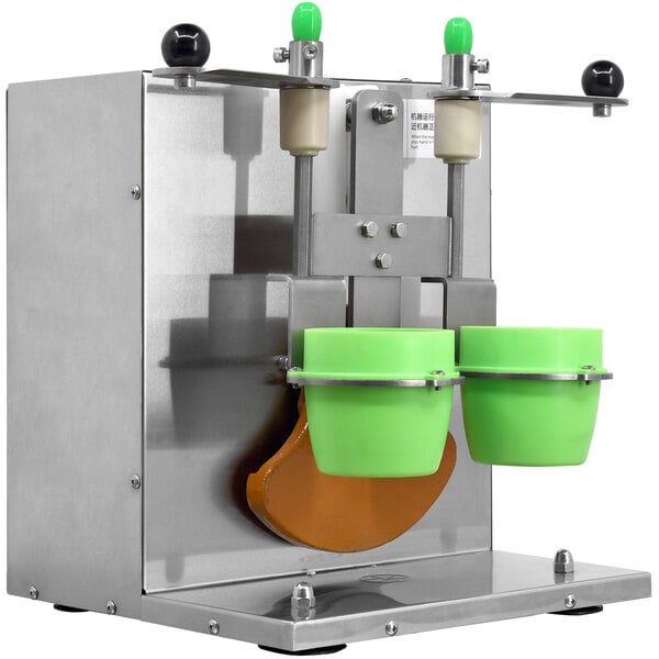 An Omcan drink shaking machine with double cup holders and two green cups on top.