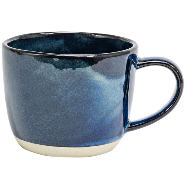 A Front of the House indigo porcelain mug with a handle and blue and white design.