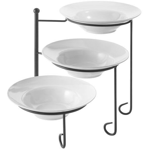 An American Metalcraft black wrought iron three-tier display stand with melamine bowls on it.