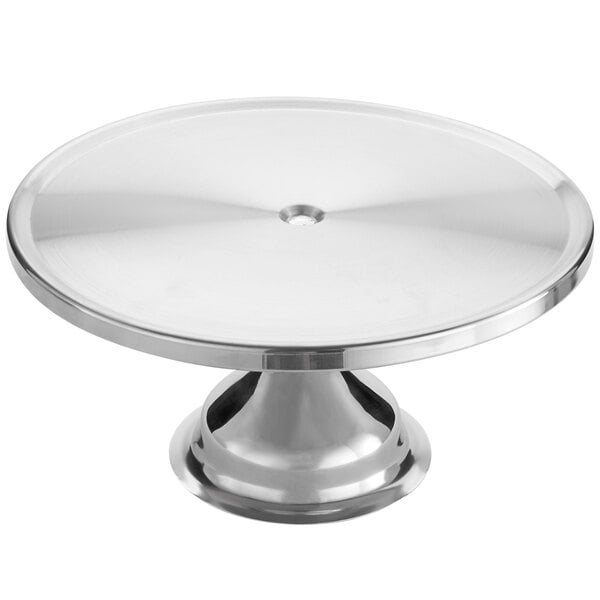 An American Metalcraft stainless steel cake stand with a round base.