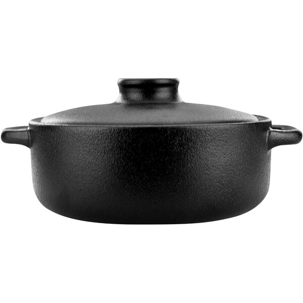 An International Tableware black stoneware casserole dish with a lid.