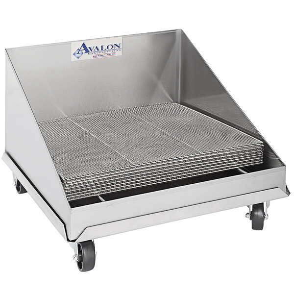A metal cart with a stack of stainless steel screen drains with wheels.