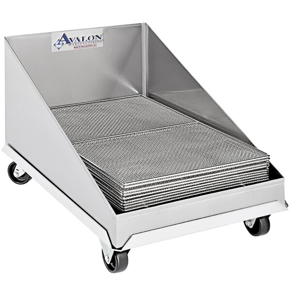 A stack of Avalon Manufacturing stainless steel screen drains on a metal cart.