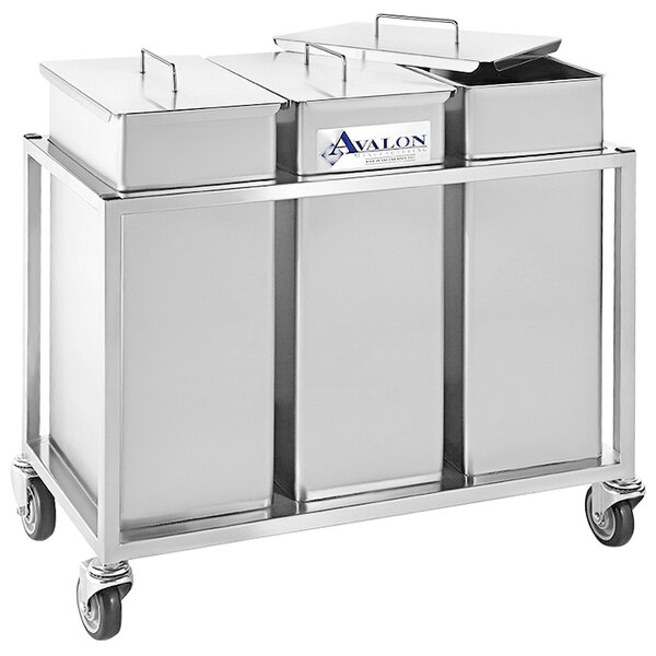 A group of stainless steel containers on a cart.