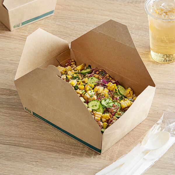 A Kraft EcoChoice take-out container on a table with food inside.