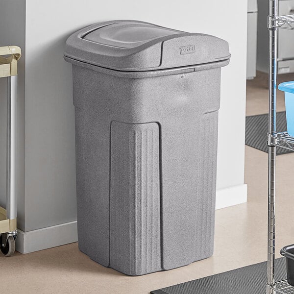 A Toter gray plastic square trash can with a square lid.