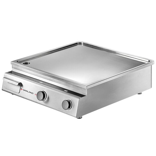 A silver Garland dual induction countertop griddle on a counter.