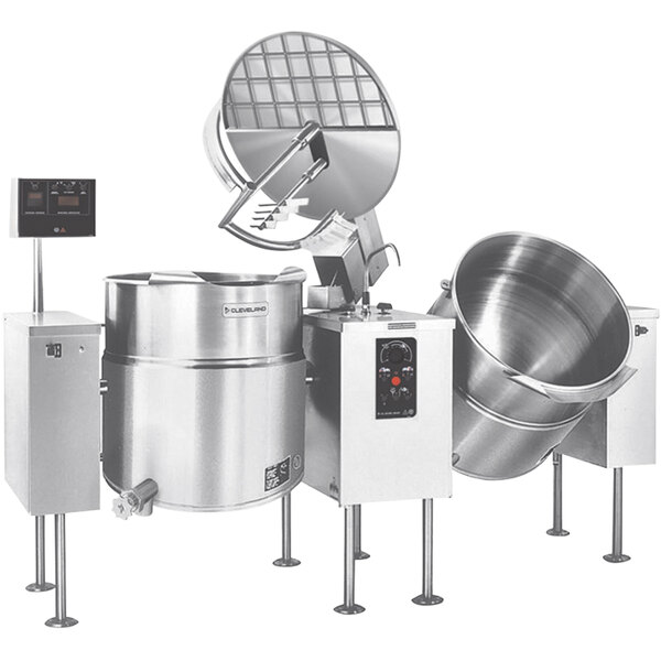 A group of Cleveland stainless steel twin mixer kettles with two metal bowls inside.