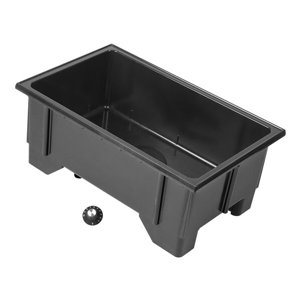 A black rectangular container with a round knob inside.