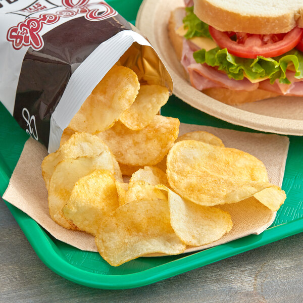 A tray with a sandwich and a bag of Goods BBQ Homestyle Potato Chips.