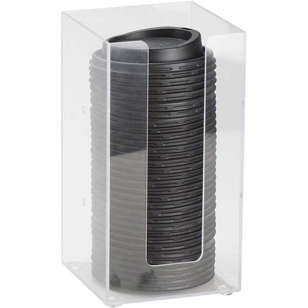 A clear plastic box holding black coffee cup lids.
