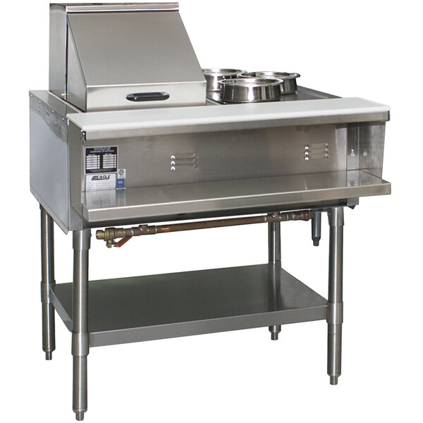 An Eagle Group stainless steel liquid propane steam table on a counter with two pans.