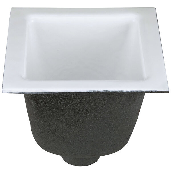 A black and white square Zurn cast iron floor sink.