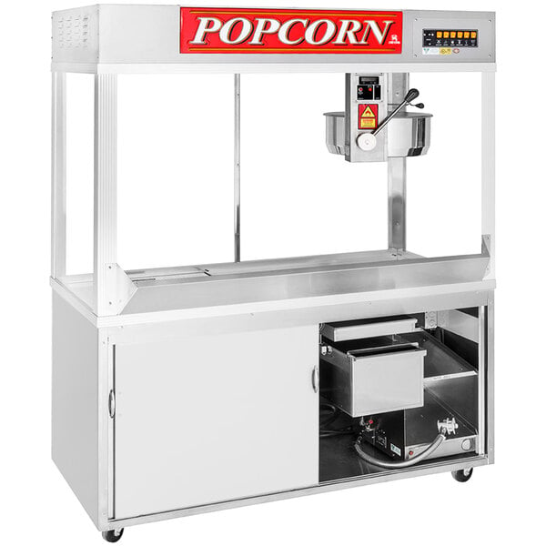 A Cretors Diplomat floor model popcorn machine with stainless steel top and bottom on wheels.