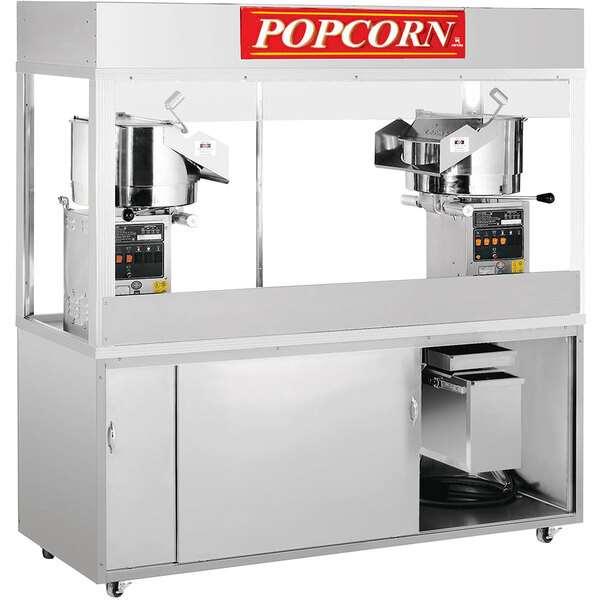 A Cretors popcorn popper machine with a large and small kettle.