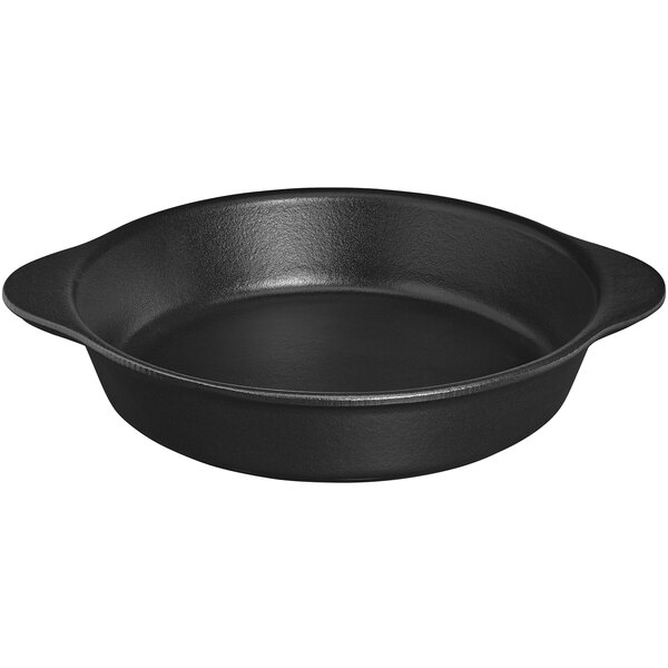 A black round Chasseur enameled cast iron casserole dish with handles.
