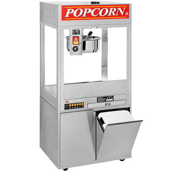 A Cretors popcorn machine with a tray, bucket, and lid.