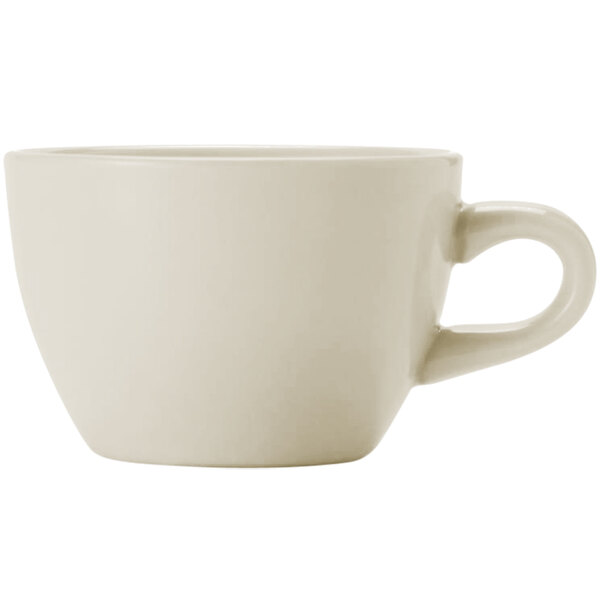A close-up of a Libbey Porcelana Cream white porcelain coffee mug with a handle.