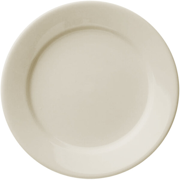A Libbey Porcelana white porcelain plate with a wide rim and rolled edge.