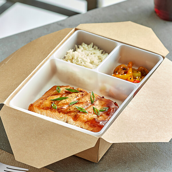 A white polypropylene take-out box with rice, vegetables, and cooked fish.