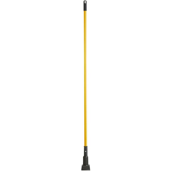 A long yellow Lavex mop handle with black jaw style handle.