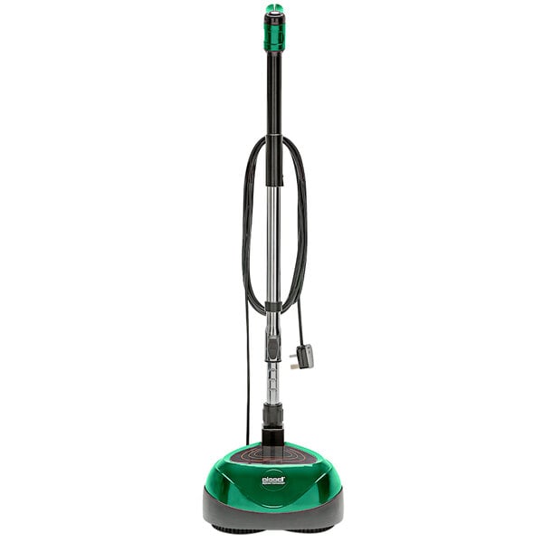 A green and black Bissell Commercial walk behind disc floor scrubber.