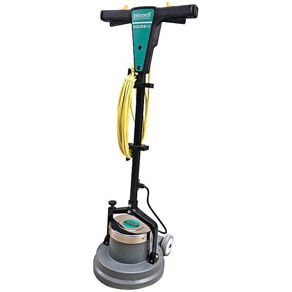 A Bissell Commercial Orbital Floor Scrubber with a yellow cord and yellow and green handles.