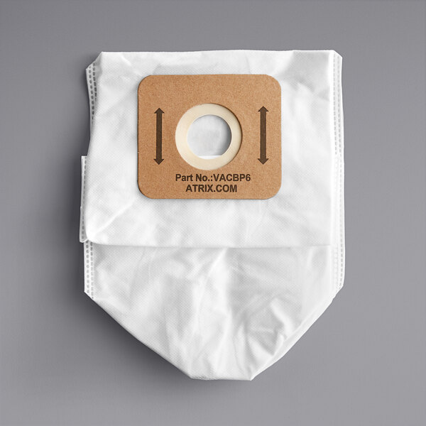 A white Atrix vacuum bag with a brown circle and arrows.