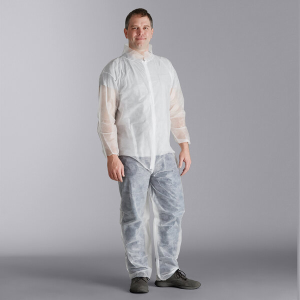 A man wearing Malt Impact white long sleeve coveralls with protective gear.