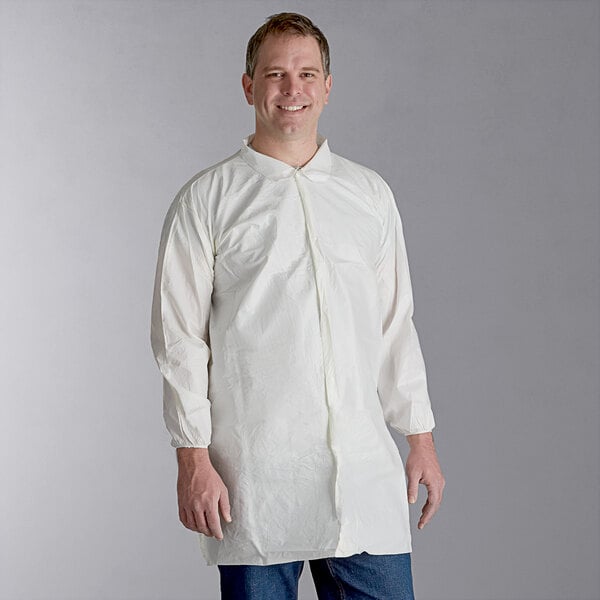 A man wearing a Malt Impact white disposable lab coat.