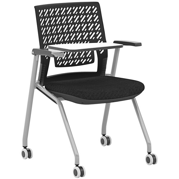 A black Safco Thesis Flex training chair with a tablet arm on wheels.