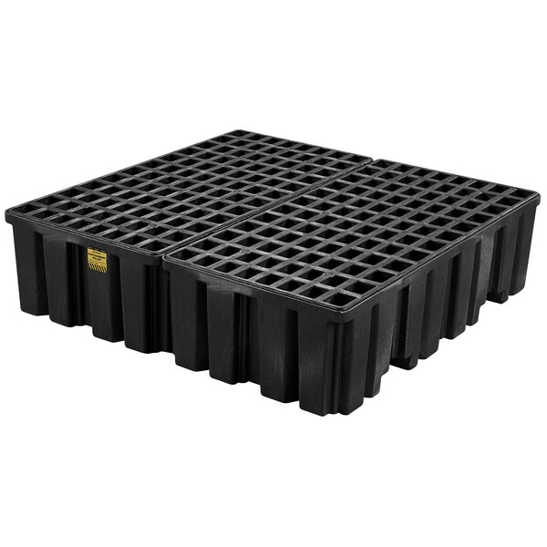 A black plastic Eagle Manufacturing large capacity pallet for four drums.