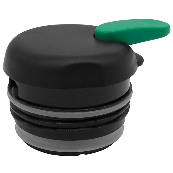 A green and black plastic Thermos carafe with a green lid on a kitchen counter.