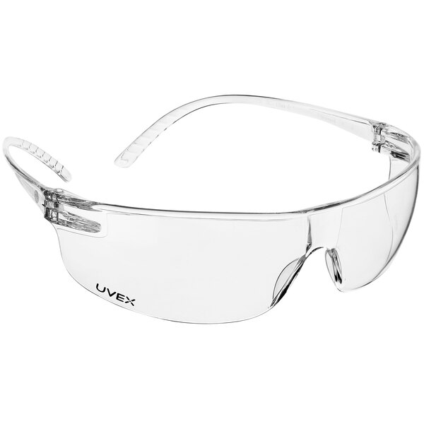 Clear Honeywell Uvex SVP200 Series safety glasses with clear plastic lenses on a white background.